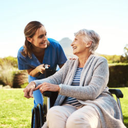 senior and caregiver woman smiling