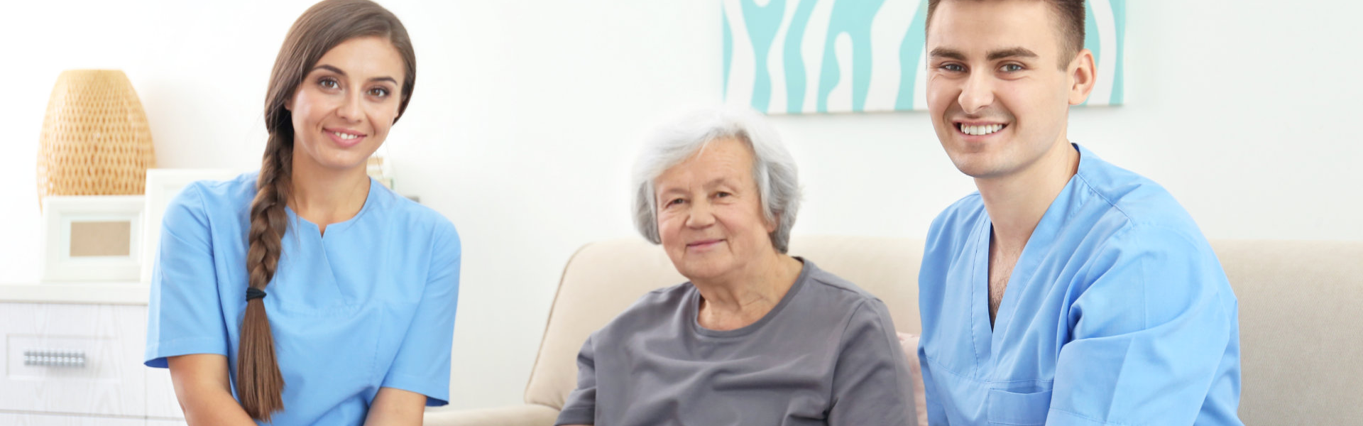 two caregiver and senior smiling