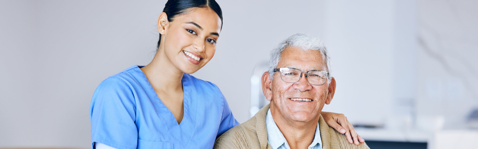 caregiver and senior smiling